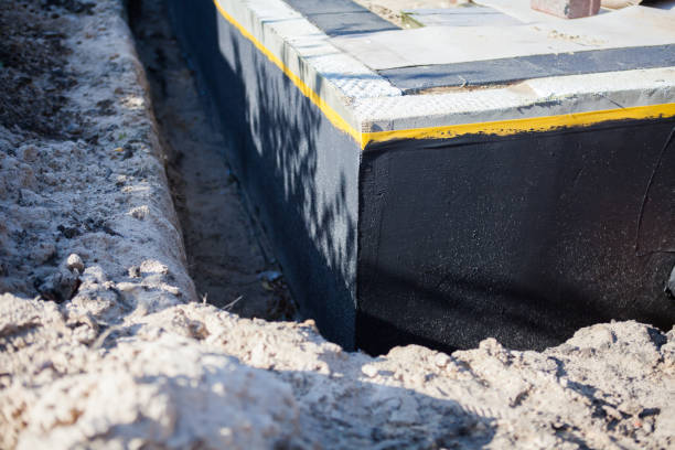 Professional Waterproofing technician working in Boon, MI